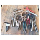 Assortment of wrenches and clamps