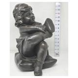 "Child Putting on Shoe" Sculpture