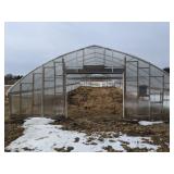 Greenhouse with two overhead doors