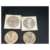 Pair of wooden nickels and a wooden buck