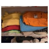Shelf of large  shirts