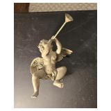 Cherub playing horn