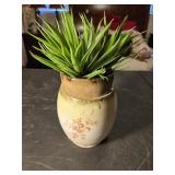 Flower arrangement in antique vase