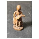 Girl carrying Goose figurine