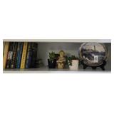 Contents of top shelf, including Nicholas Sparks