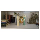 Contents of shelf, including angel figurine,