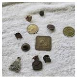 Miscellaneous group of pendants and gaming token