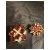 Pair of red broaches