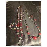 Pair of necklaces and bracelet plus earrings.