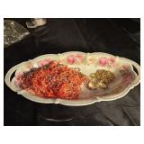 Vintage serving dish filled with jewelry