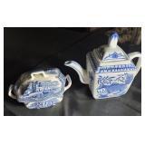 Blue and white creamer and sugar mismatched.