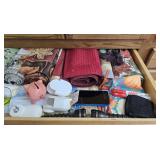 Contents of drawer. Place mates, flashlight etc.