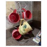 Four temptation mugs and a rooster mug with stand
