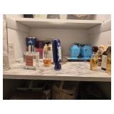 Contents of shelf, including perfume, etc