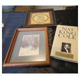 A Nat King Cole book and two prints