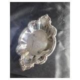 Silver colored bowl 9 inches across at longest