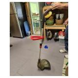 An electric weed eater with string