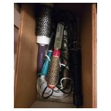 Contents of drawer curling irons in drawer