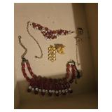 Pair of costume necklaces in drawer
