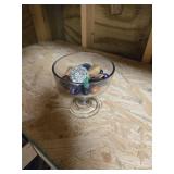 Candy dish with miscellaneous rocks and a glass