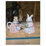 Two cute bunnies watering