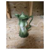 Small green vase, has chip on lid