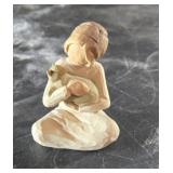 Willow tree figurine of girl holding cat