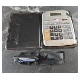 A calculator and a custom chemicals knife