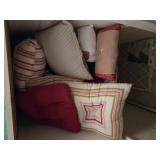 Contents of shelf, pillows