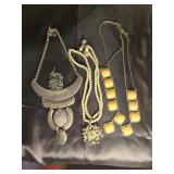 3 necklaces and earrings