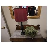 Lamp and plant on top of small dresser