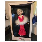Marilyn Monroe doll and a book of paper dolls