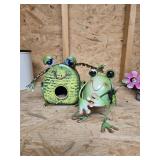 A frog birdhouse and another frog