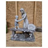Mom helping boy statue, approximately 12 inches