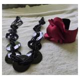 Beautiful black necklace and a red bracelet