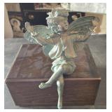 A fairy on a wooden box