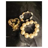 Pair of bracelets and heart broach