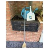 Watering can and dust pan with broom
