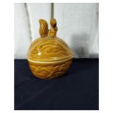 Adorable squirrel on a walnut storage dish approx