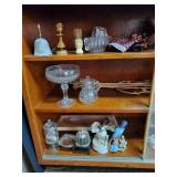 Contents on shelves including candleholder and