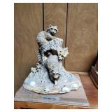 Raccoons in tree figurine approx 8 inches tall
