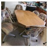 Kitchen table and 6 chairs it also has a leaf