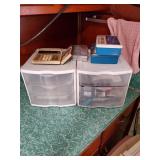 Pair of storage boxes and first aid items