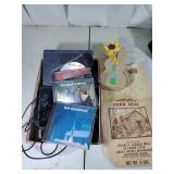 Cornmeal bag, gospel CDS, arithmetic book and