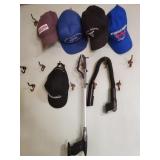 Group of hats and a snake light and a grabber