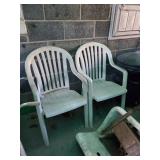Pair of white plastic chairs