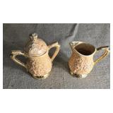 Sugar and creamer unmarked  7 inches tall