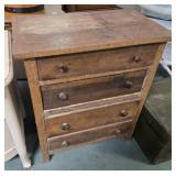 4 drawer oak chest 26 X 15 X 32 inches tall.