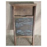 Country brass washboard made of wood and brass.