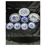 8 blue and white plates.